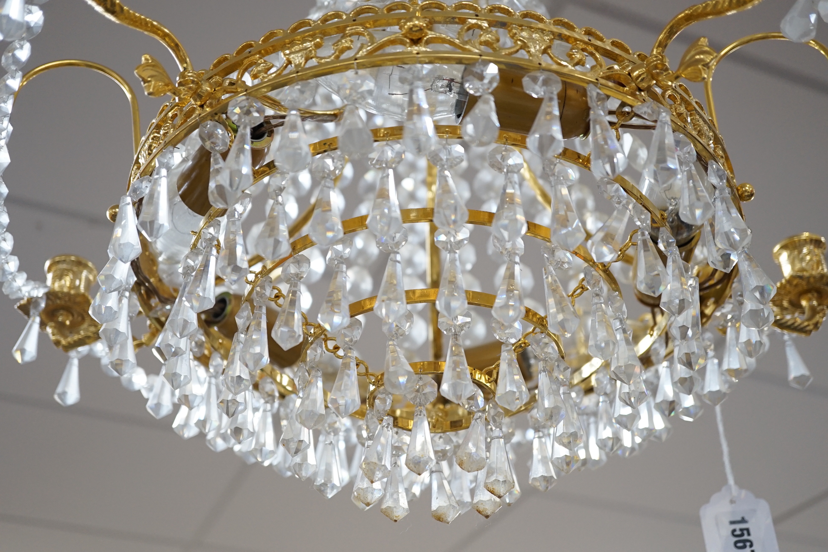 A brass and glass drop three tier chandelier, light approximately 53cm high (not including chain)